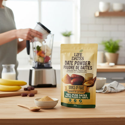 Life Dates Date Powder beside a blender, fruit and a bowl of date powder